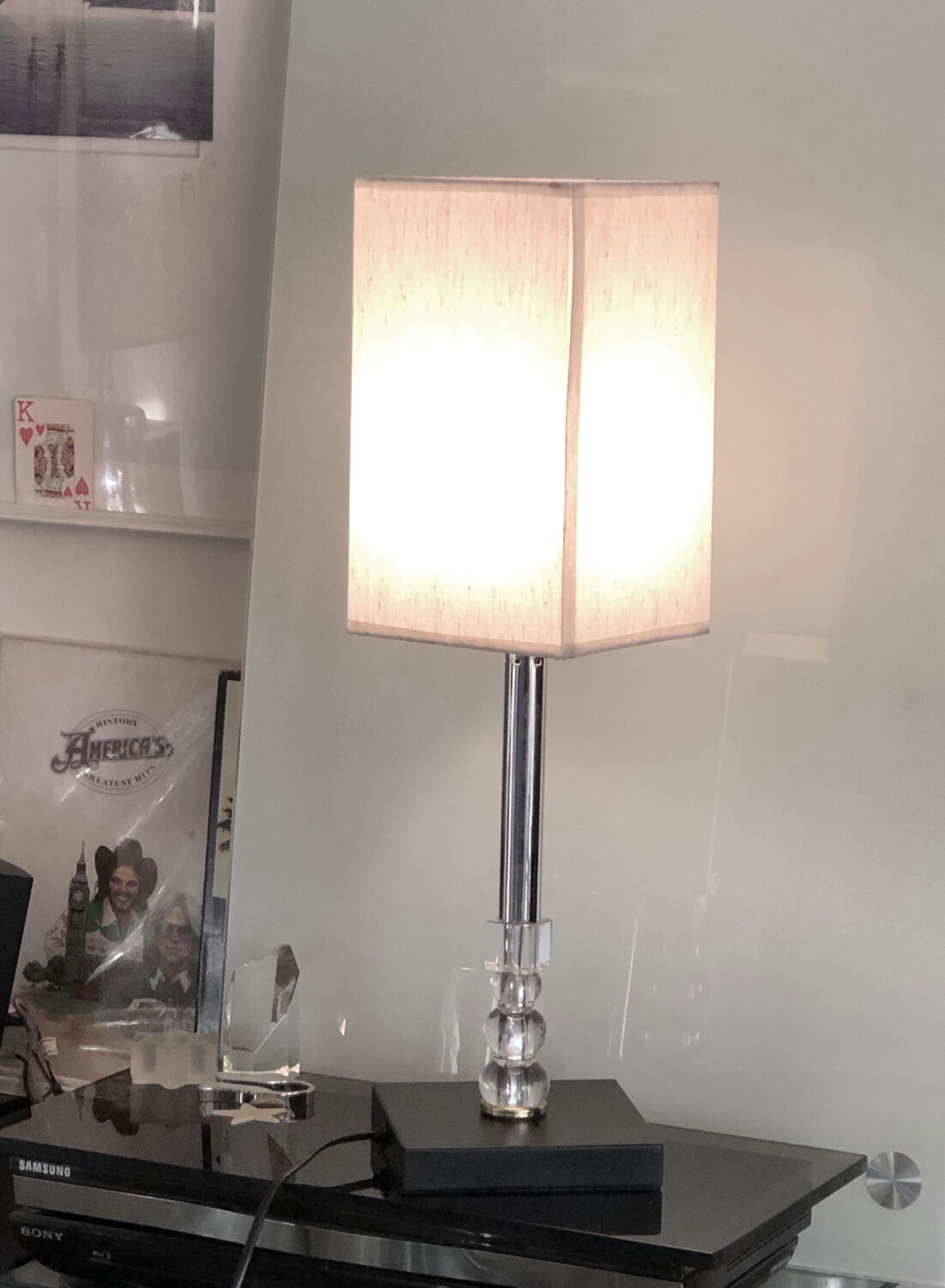 Silver floor lamp with a straight shade.