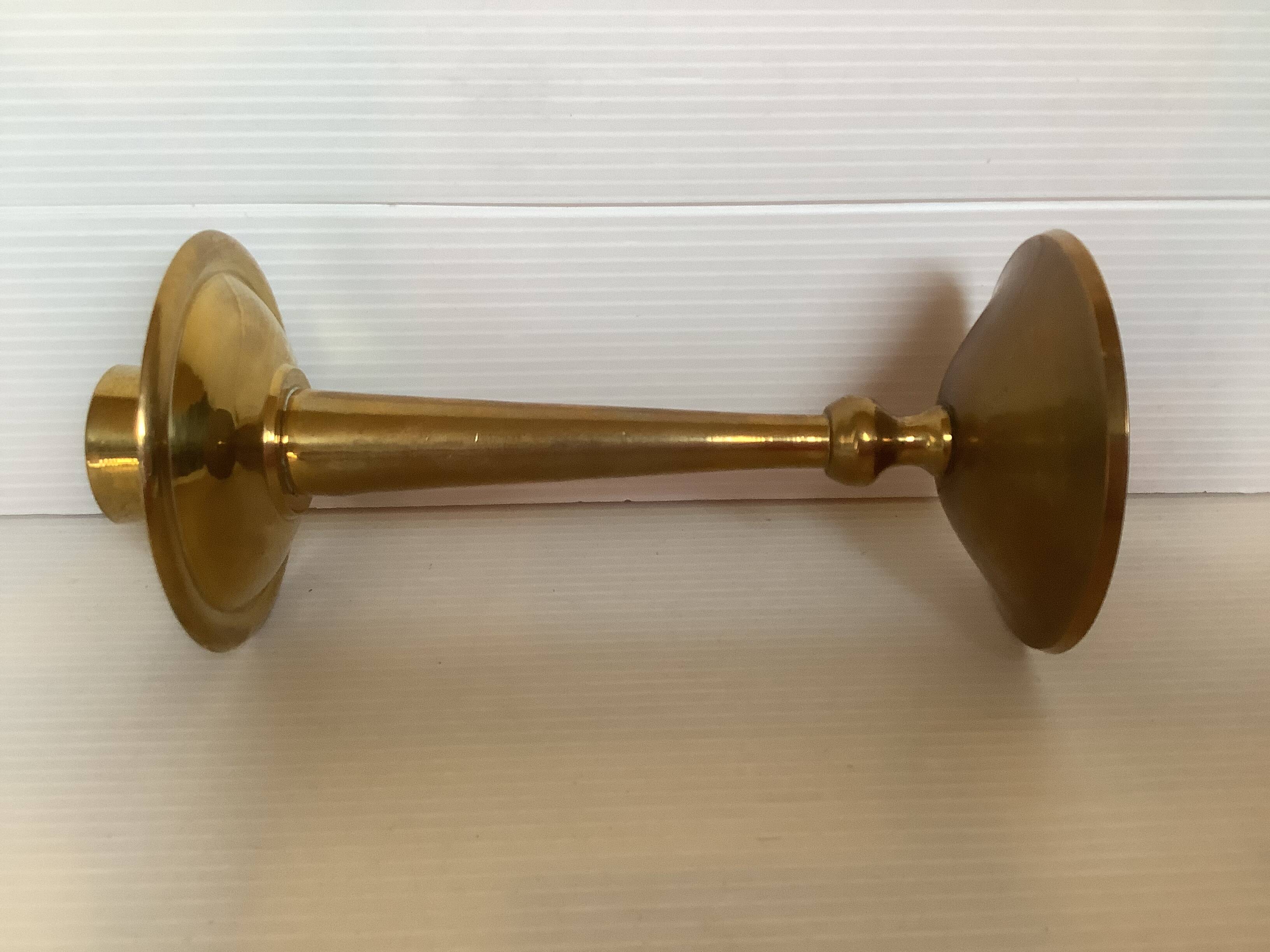 Asymmetrical brass candle holder