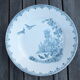 Duo of old plates in Iron Earth decorated with birds and butterflies