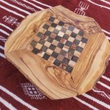 Rustic handmade chessboard made of olive wood