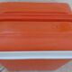 Glaciere vintage de couleur orange avec poignet  de marque EDA