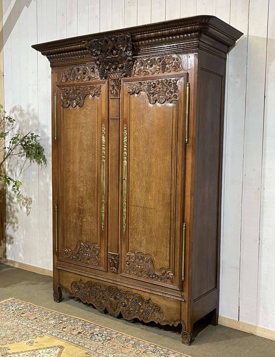19th-century Norman wedding armoire in blonde oak.