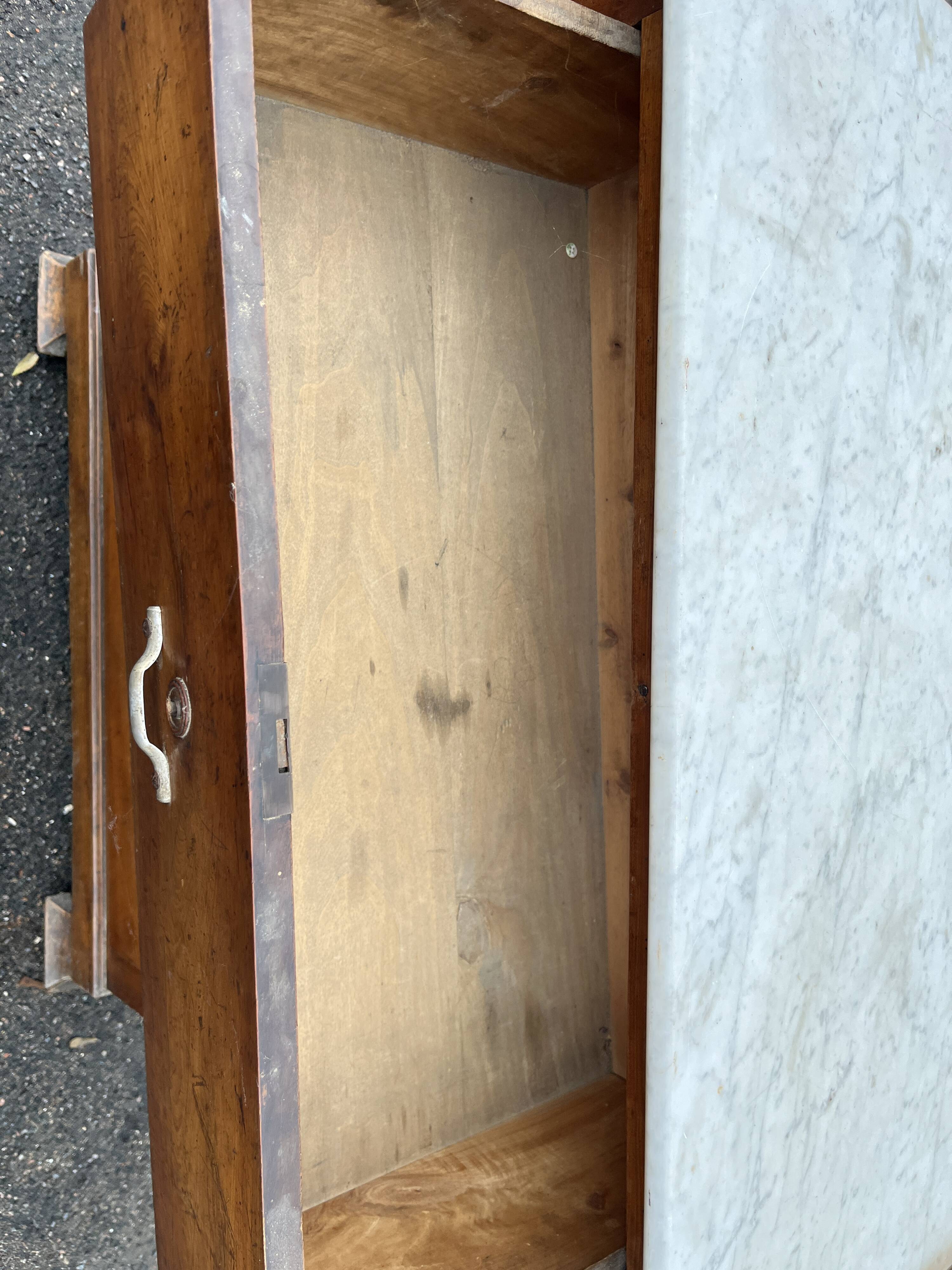 Antique 19th-century wooden chest of drawers with a marble top