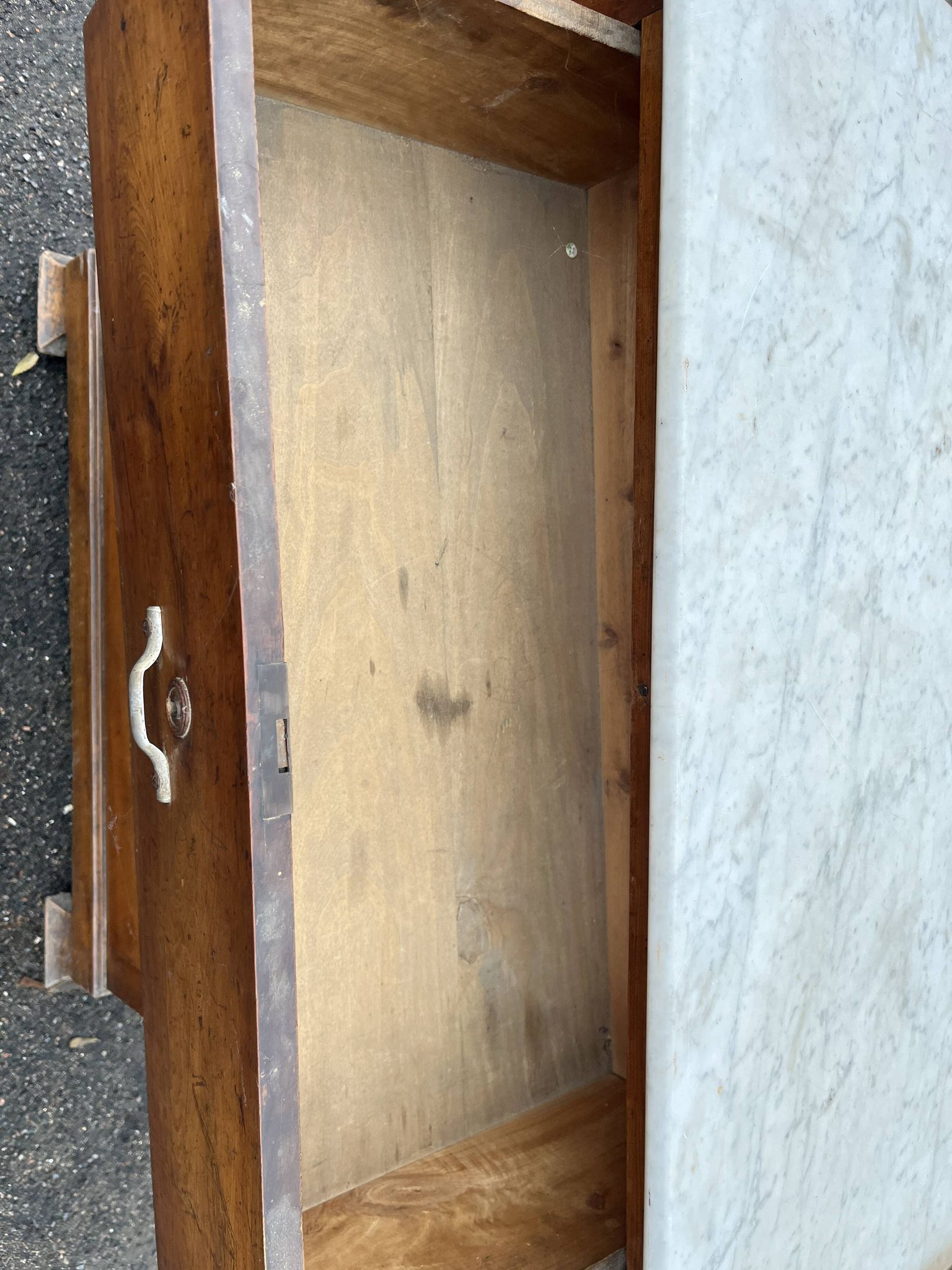 Antique 19th-century wooden chest of drawers with a marble top