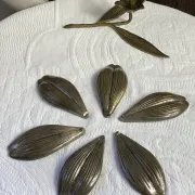 Flower candlestick and removable ashtrays in solid brass.