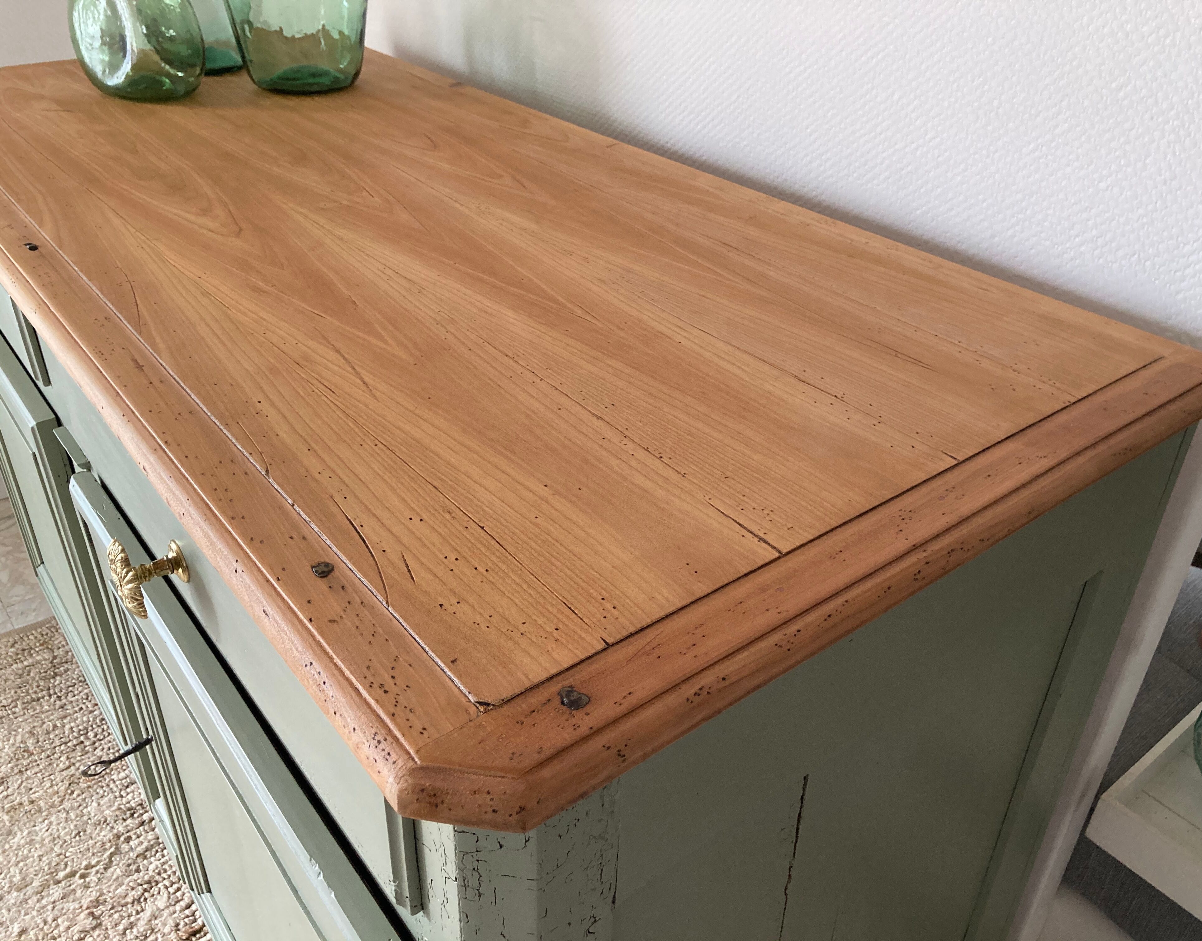 Pastel green low buffet, raw wood tray