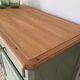Pastel green low buffet, raw wood tray