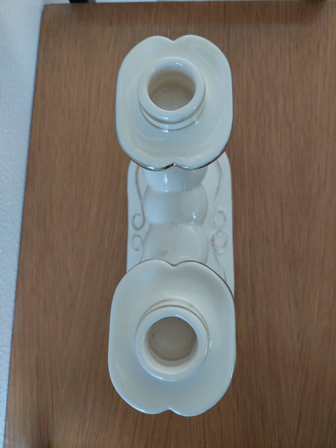 Pair of cream ceramic candlesticks with gold trim circa 1930-1950