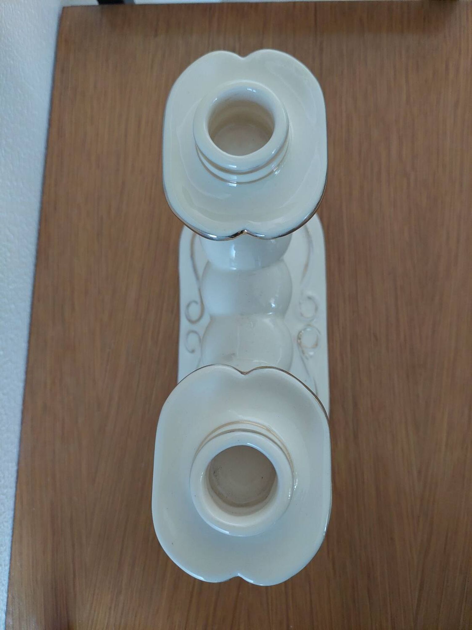Pair of cream ceramic candlesticks with gold trim circa 1930-1950