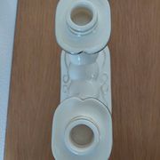 Pair of cream ceramic candlesticks with gold trim circa 1930-1950