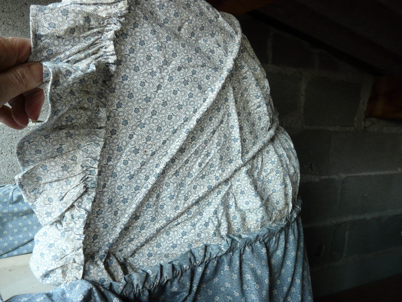 Old wooden cradle and wicker on wheels