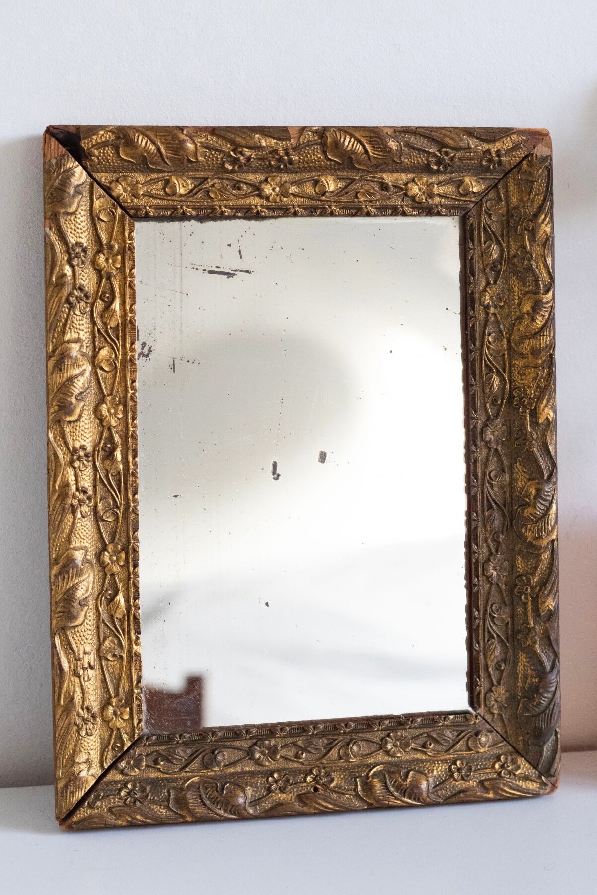 Antique mirror in gilded wood