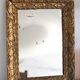 Antique mirror in gilded wood