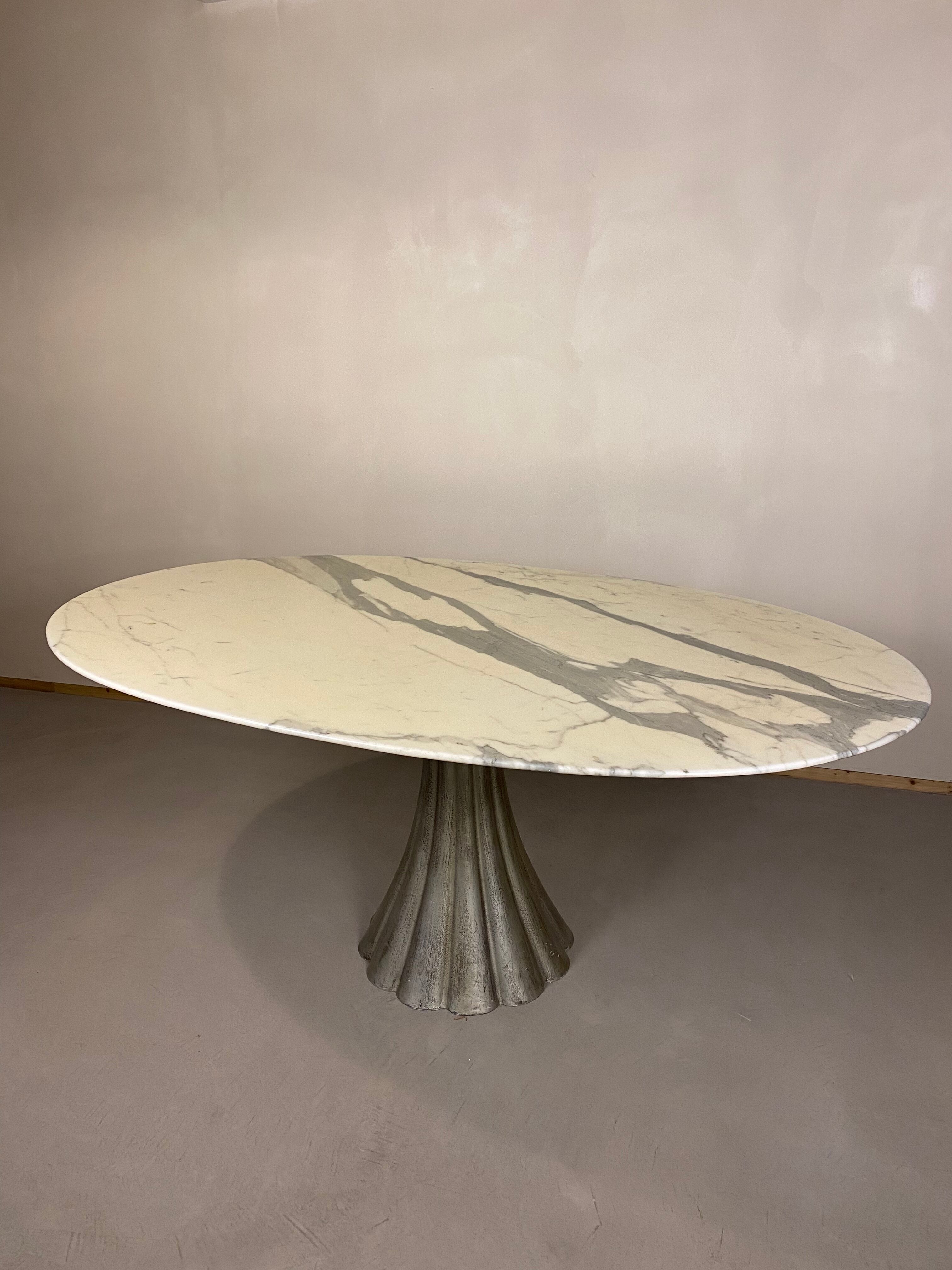 Oval marble dining table with iron base