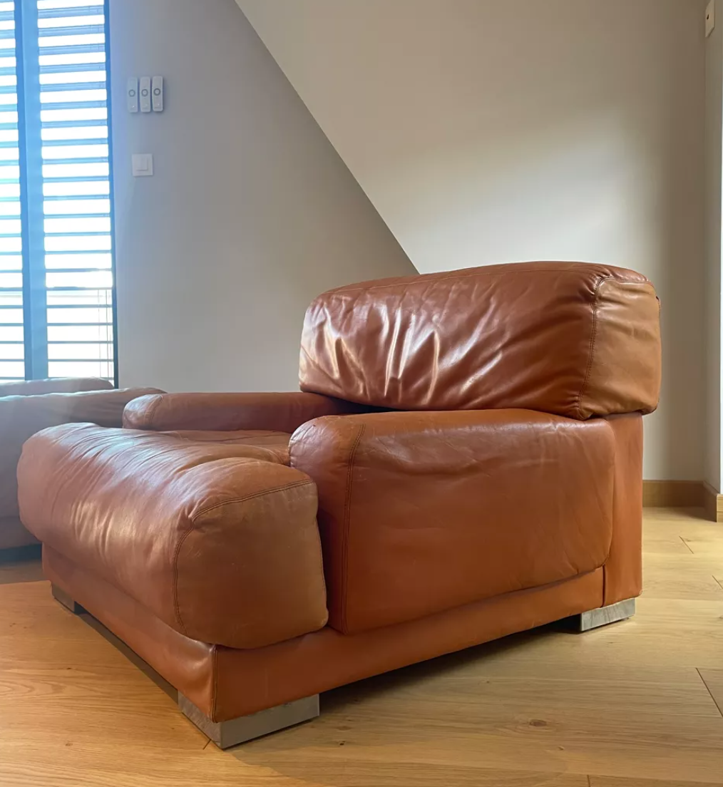 Pair of vintage armchairs Gérard Guermonprez tawny leather and stainless steel, France 1970