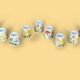 Set of 9 mini vintage porcelain candle holders decorated with spring flowers.
