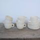 Series of 7 vintage ceramic cups and saucers by Le Pot de Terre
