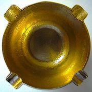 Three "vintage" bronze ashtrays with golden natural patina forming mortars with their drumsticks