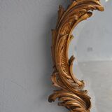 Miroir en stuc doré rocaille époque XIXème 110cm
