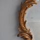 Miroir en stuc doré rocaille époque XIXème 110cm