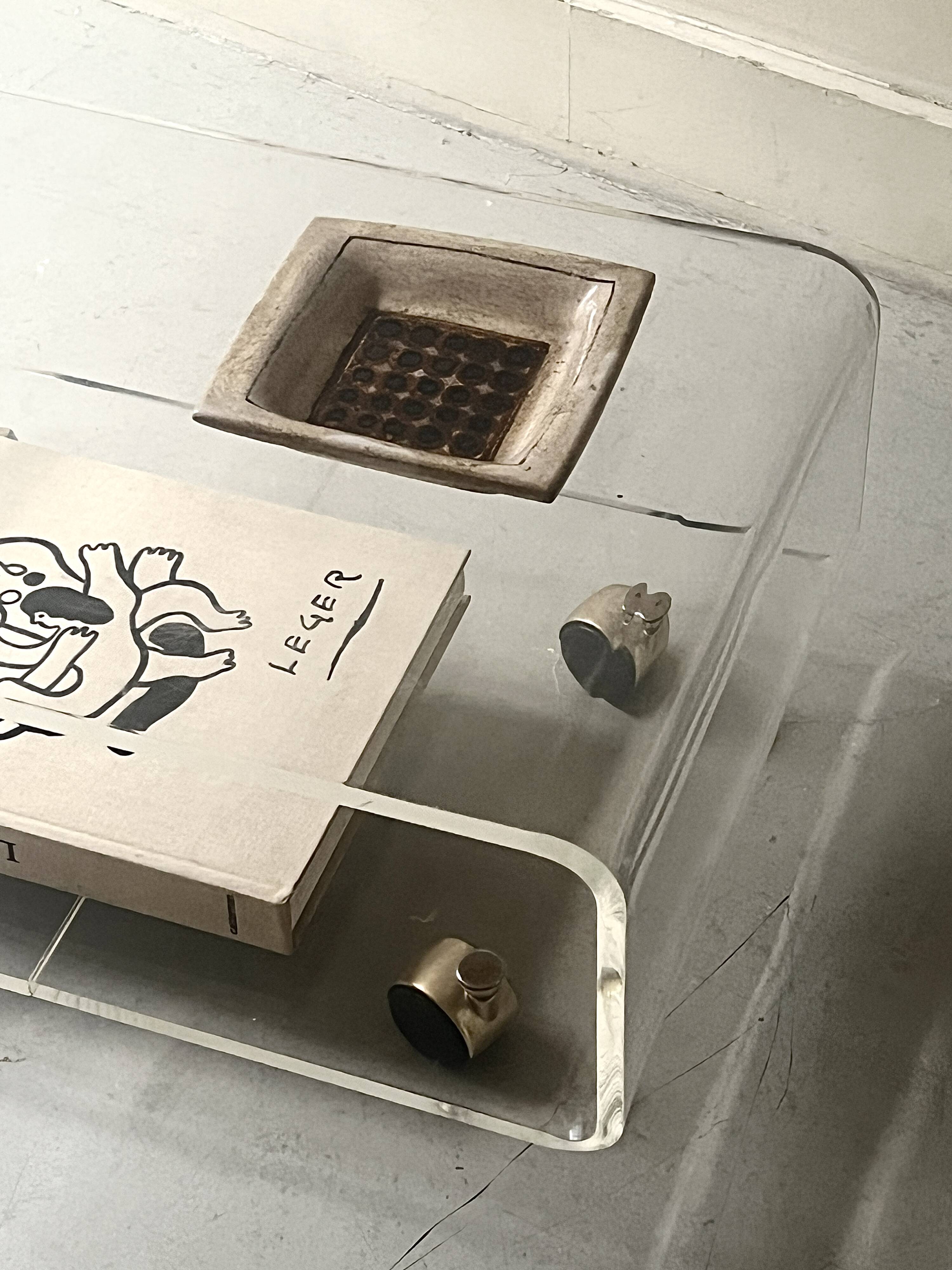 Transparent plexiglass coffee table by Roche Bobois, 1970s design.