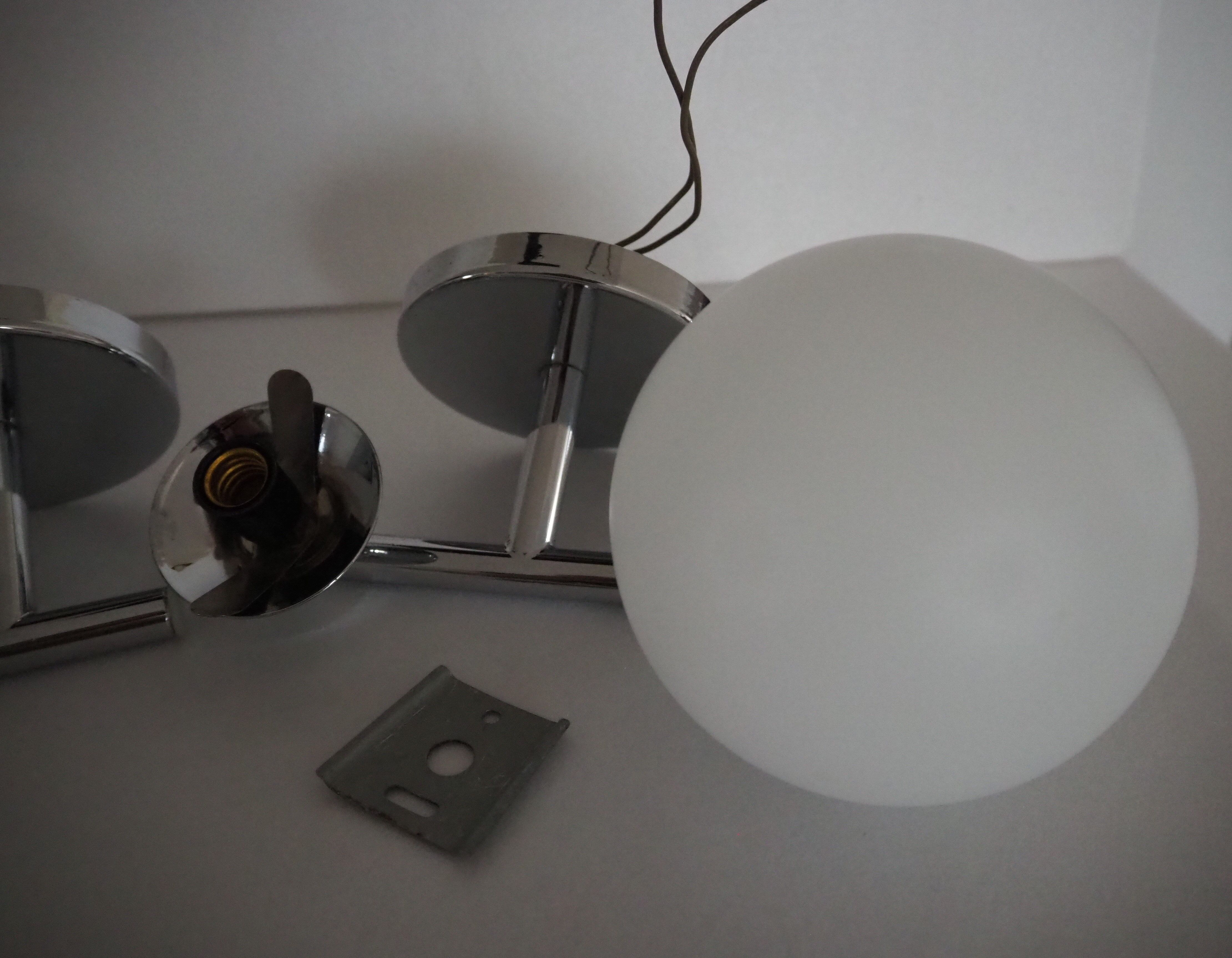 Pair of sconces with an opaline globe and chrome structure from the 1970s