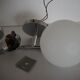 Pair of sconces with an opaline globe and chrome structure from the 1970s