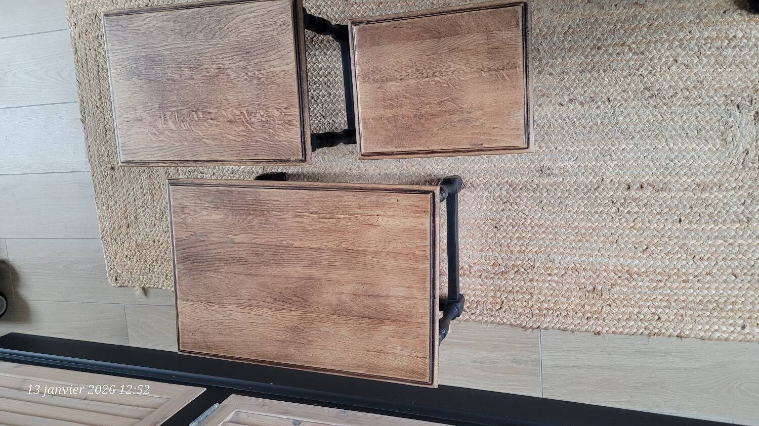 Nest tables in wood and black.