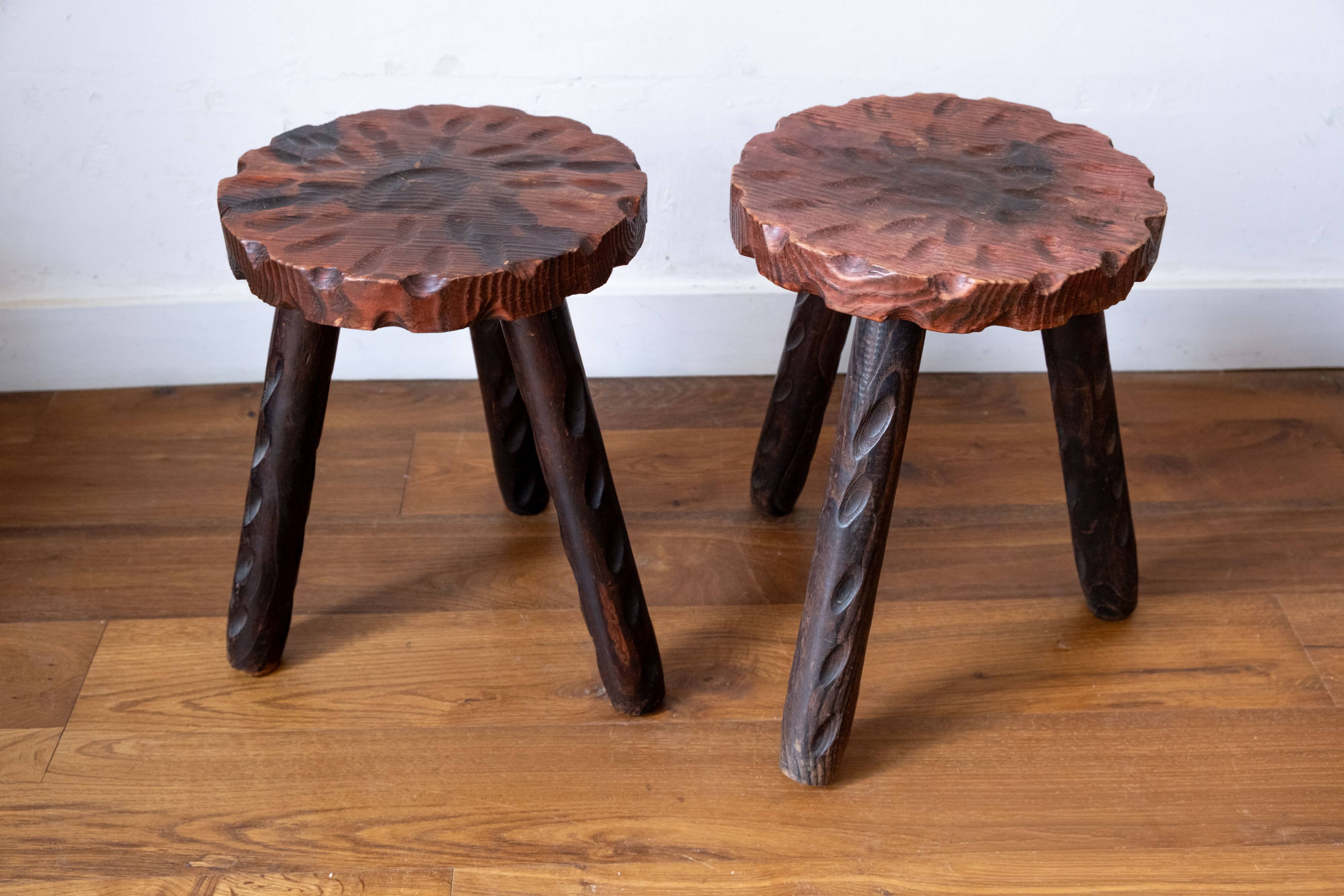 Set of two vintage round tripod stools, wooden farm stools.