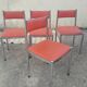 Set of 4 vintage chrome and orange faux leather chairs.