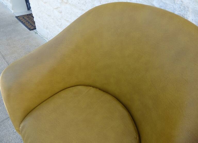 Vintage swivel armchair from the 70s in imitation leather