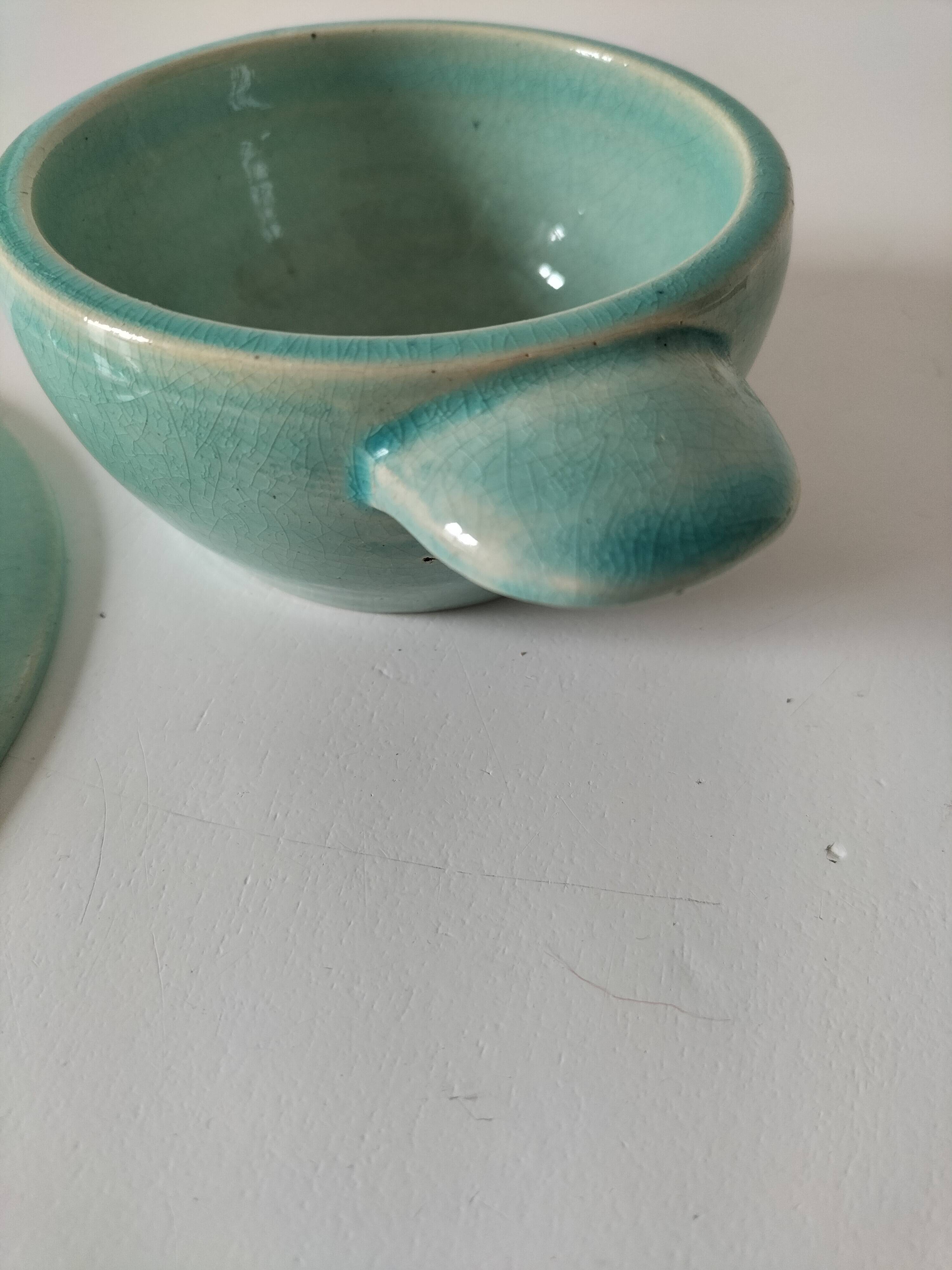 Earthenware bowl and saucer in glazed water green ceramic.