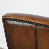 Vintage sheepskin armchair with beautiful warm colors and excellent seating comfort