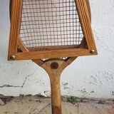 Old wooden tennis racket with frame