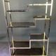 Italian shelf in gold-plated metal and smoked glass