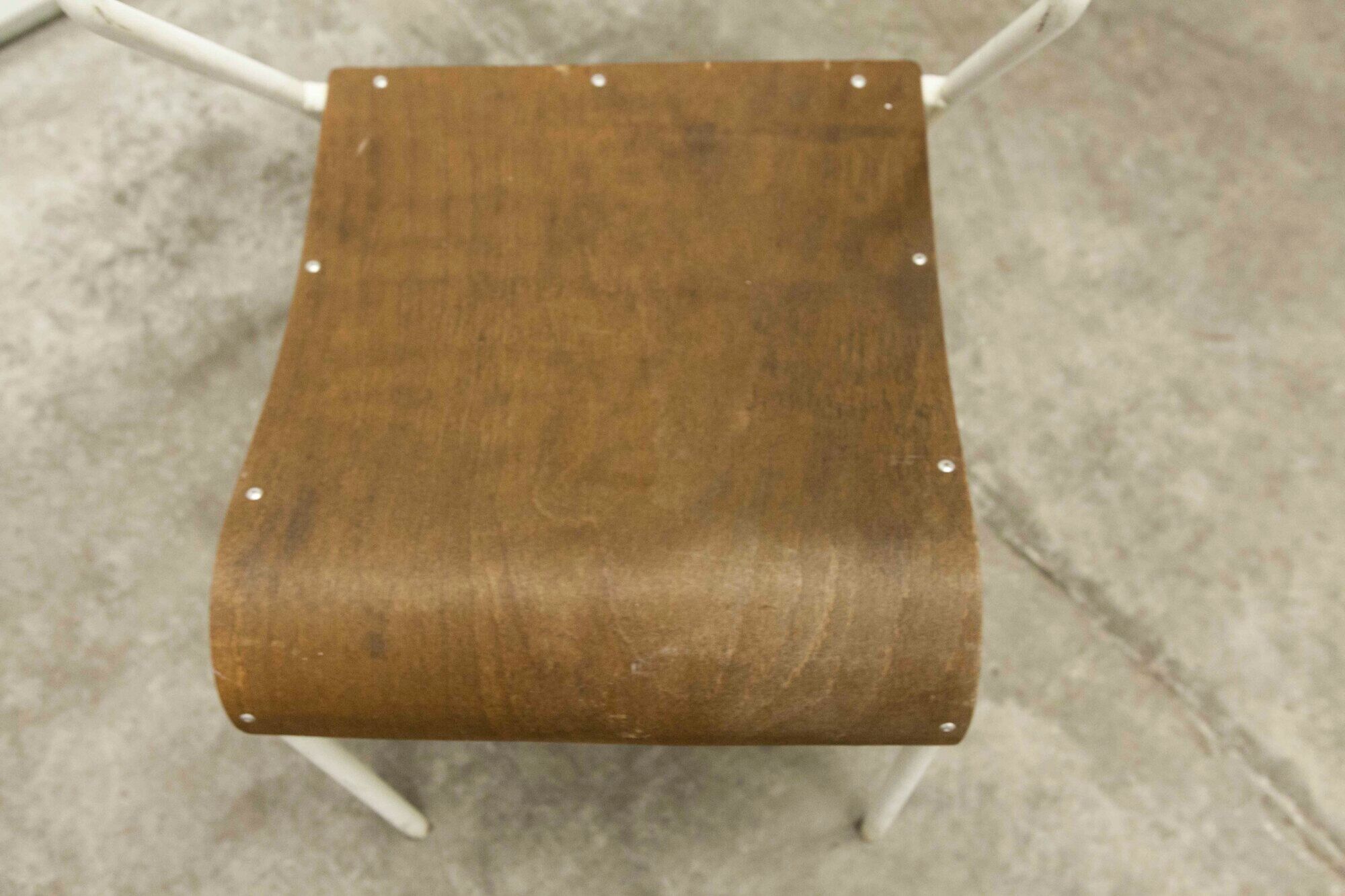 Atypical chair of the 70s metal and wood