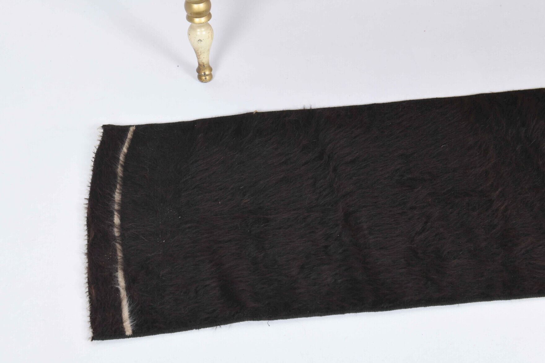 Small vintage flat-woven black rug.