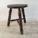 Tabouret en bois tourné tripode vintage