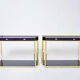 Pair of black lacquered consoles and brass 1970
