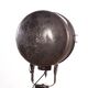 Old industrial spot on wooden tripod floor lamp
