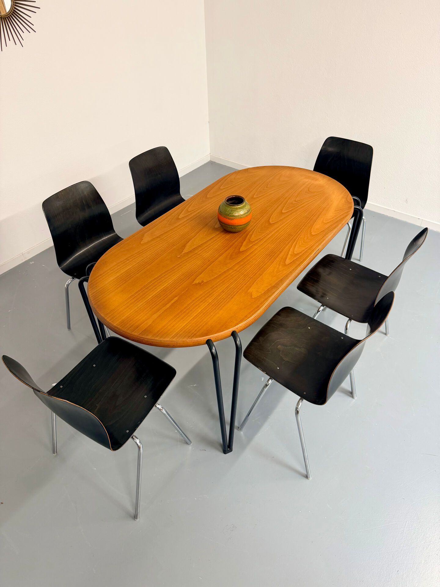 Solid wood dining table with tubular legs, 1980s postmodern design.