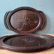 Set of two vintage carved oak service trays