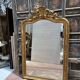Louis XV style mirror in gilded wood and stucco, 20th century.