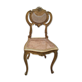 Antique rococo chair in gilded wood and caning