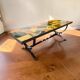 Vintage stone coffee table with a cast iron frame.
