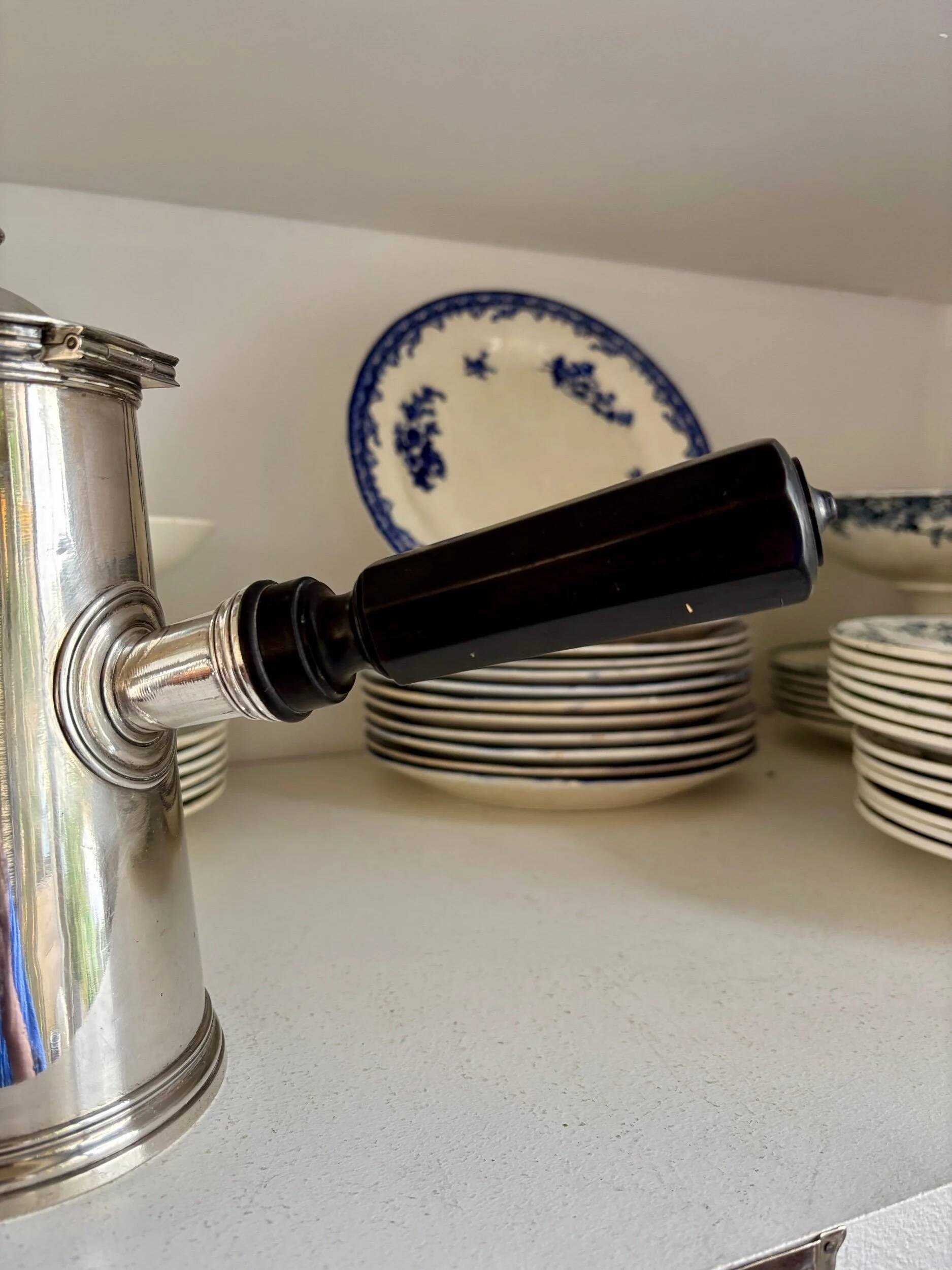 Christofle silver-plated chocolate pot and coffee pot with a blackened wooden handle.