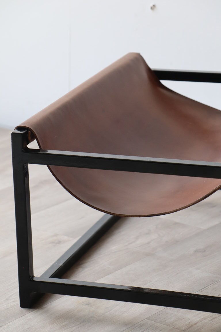 Pair of vintage armchairs in stretched leather and metal structure