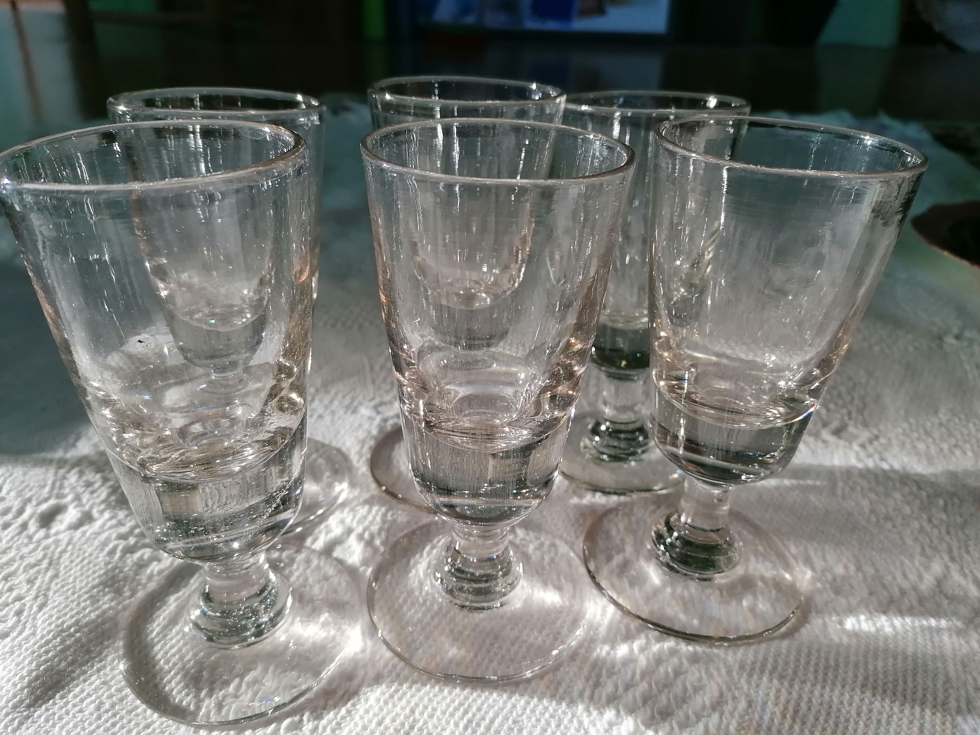 Absinthe service glasses and spoons.