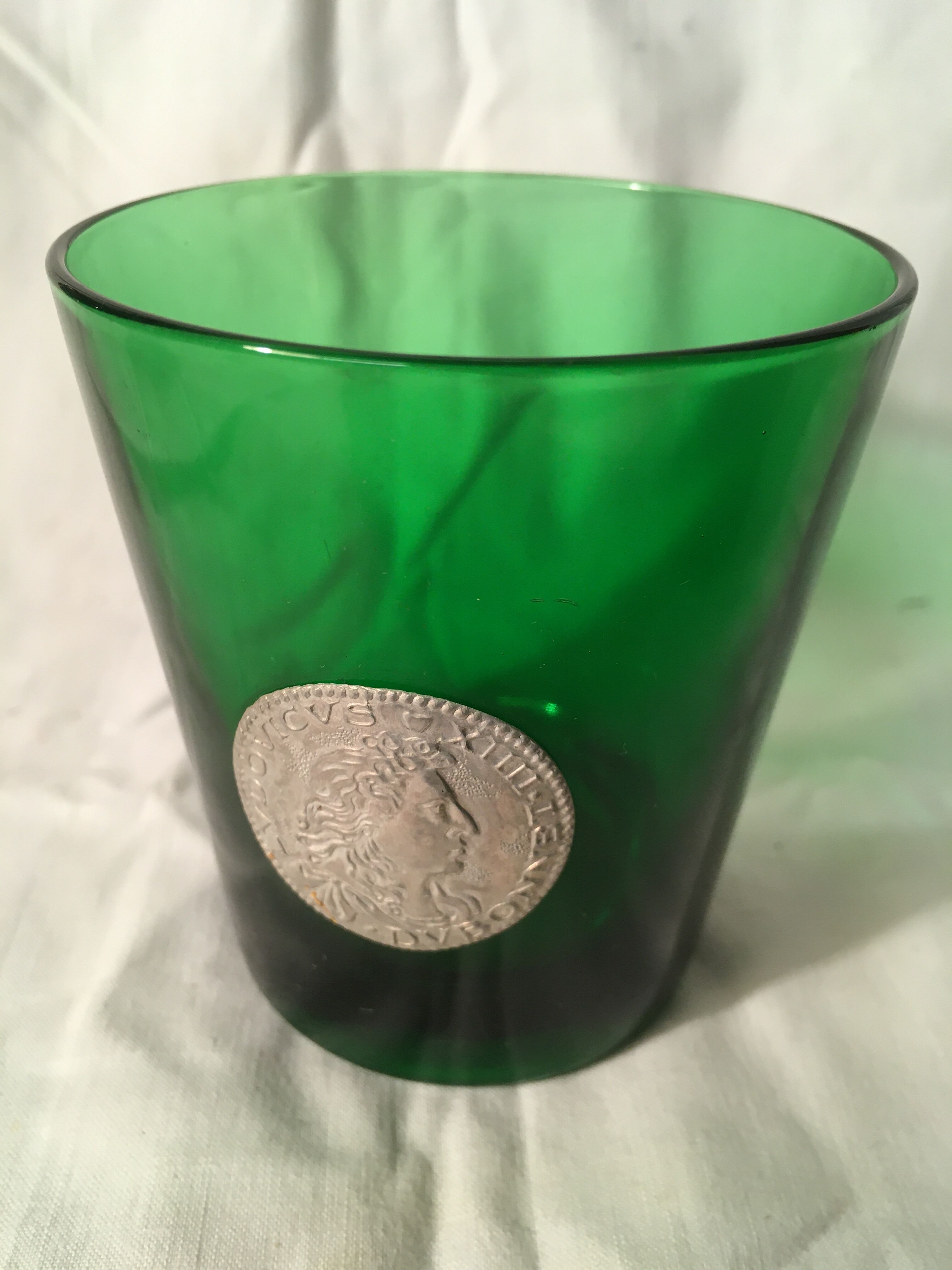 3 green glasses with silver gold shields