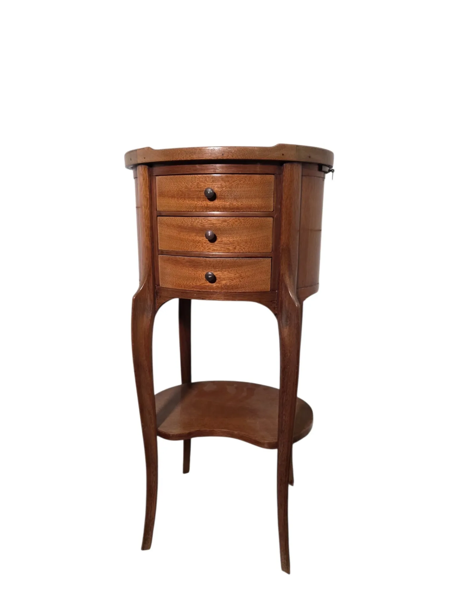 Oval bedside table in Louis XV style made of mahogany.